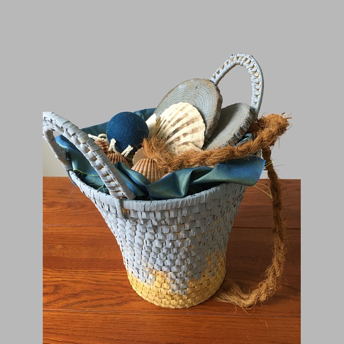 Basket filled with decoration sea and beach